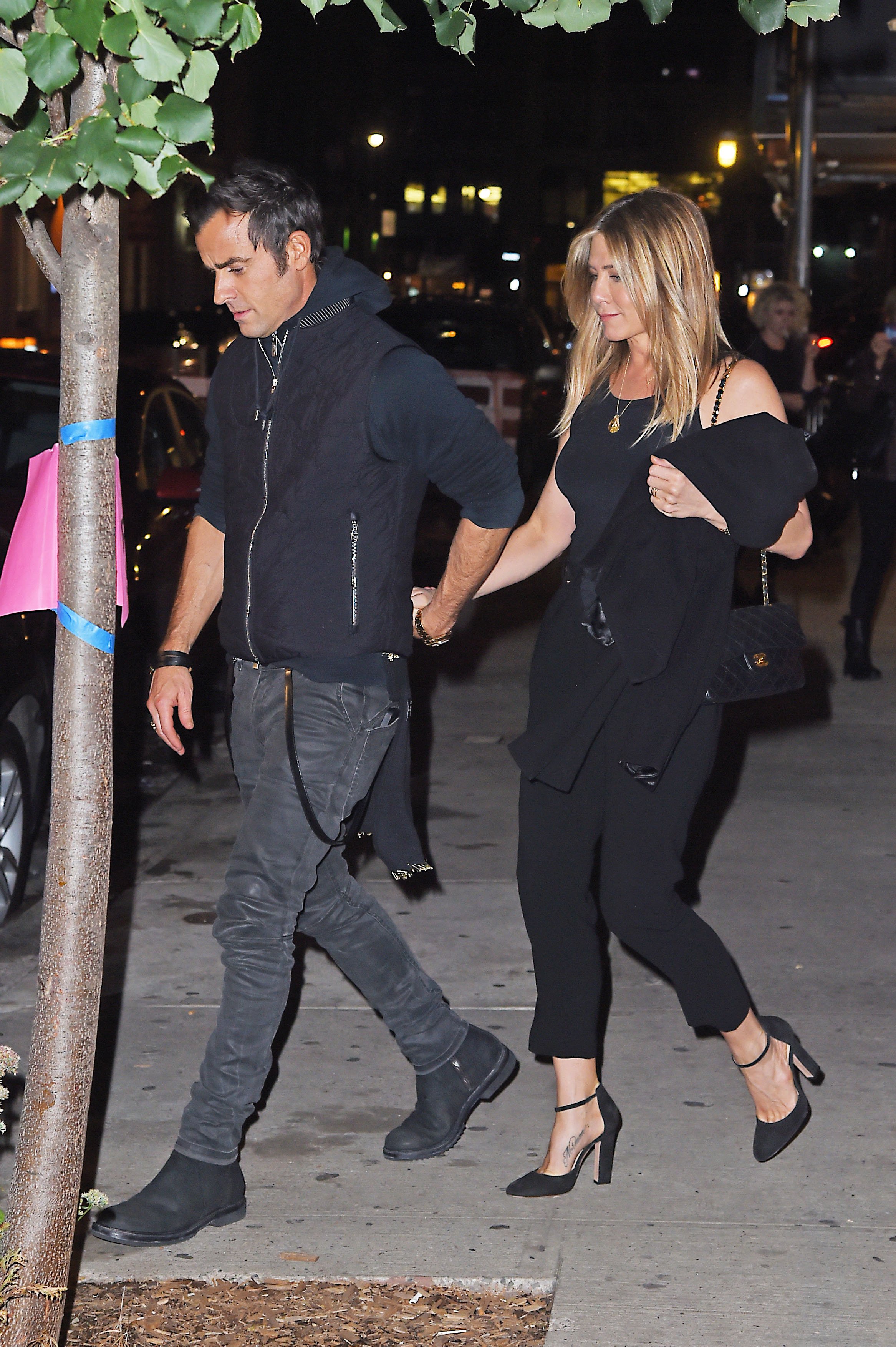 Jennifer Aniston and Justin Theroux get dinner with friend Carlos Quirarte with his wife on September 24, 2016 in New York