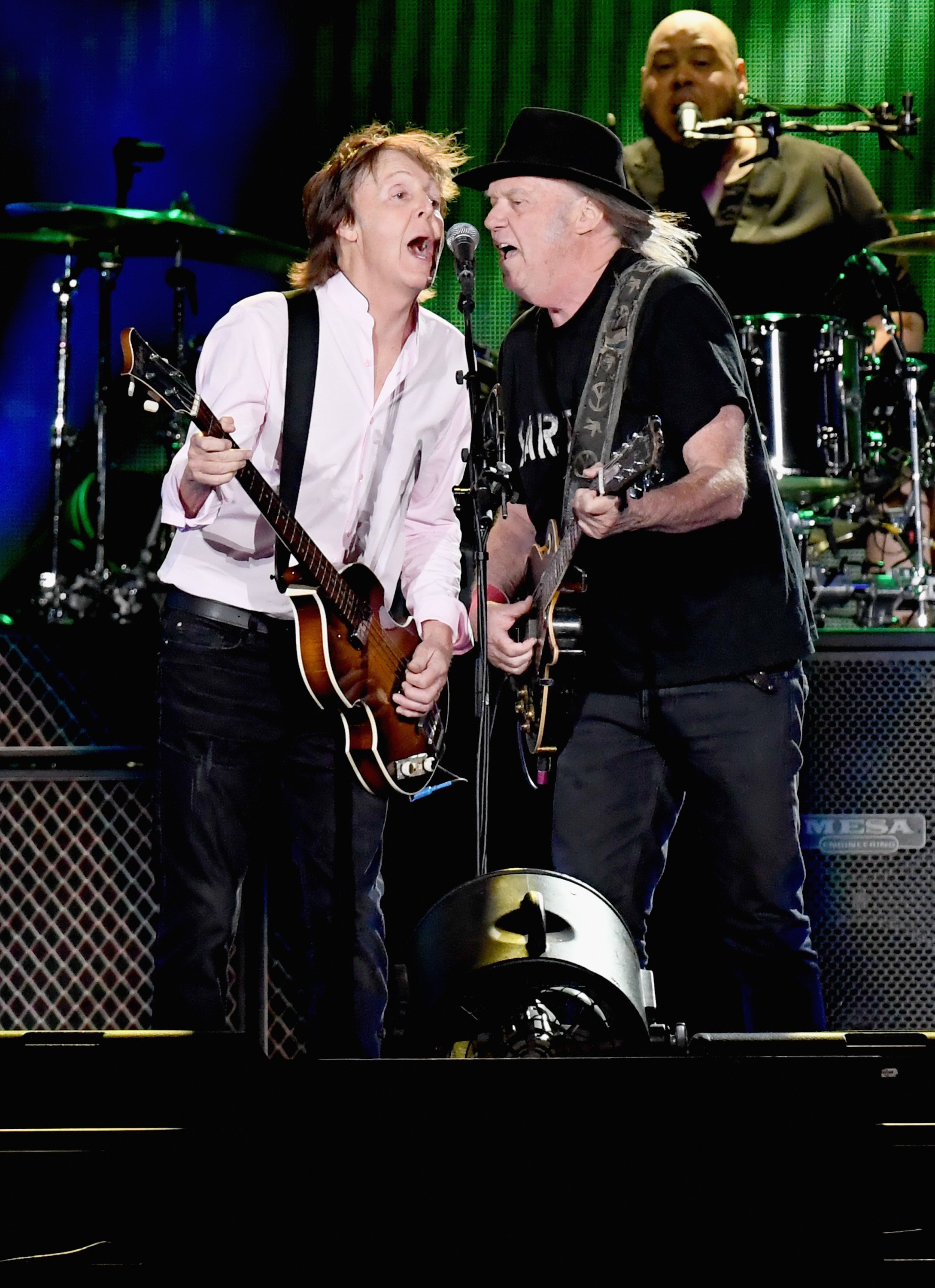 Paul McCartney and Neil Young perform onstage during Desert Trip at the Empire Polo Field on October 8, 2016 in Indio