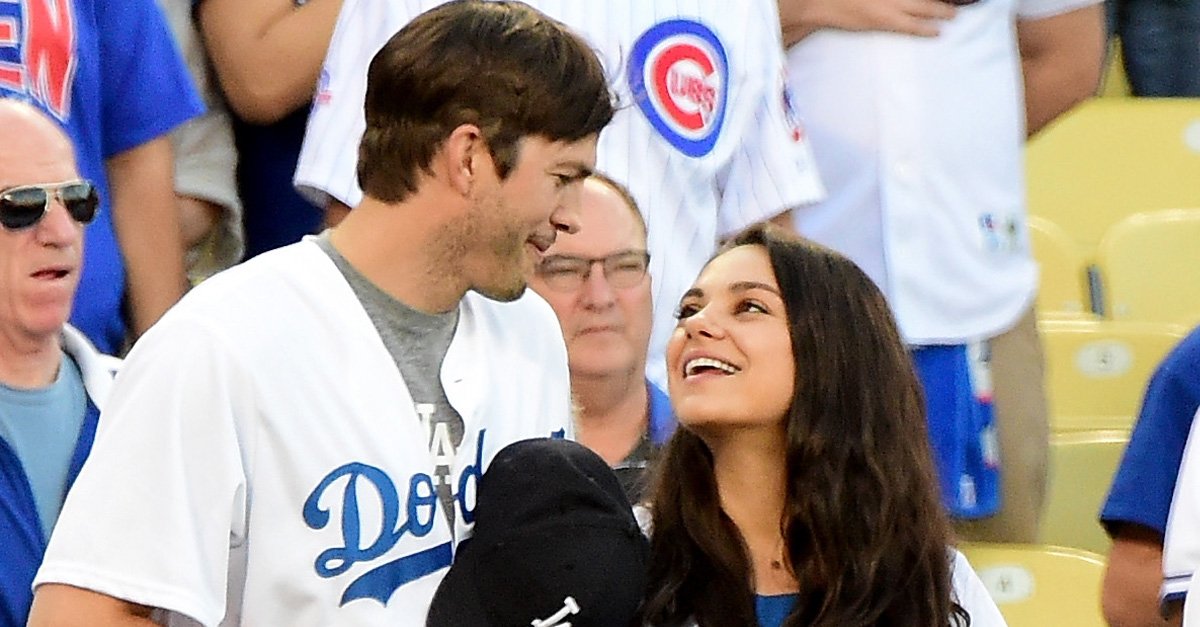Ashton Kutcher and Mila Kunis on the field after they announced the Los Angeles Dodgers starting lineup before game four of the National League Championship Series againt the Chicago Cubs at Dodger Stadium on October 19, 2016 in Los Angeles