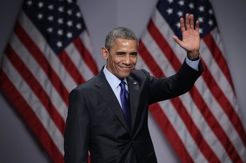 President Barack Obama waves after speaking during the SelectUSA Investment Summit on March 23, 2015 in National Harbor, Md.