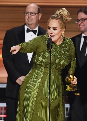 Adele accepts the Record Of The Year award for 'Hello' onstage during The 59th Grammy Awards at StaplesS Center on February 12, 2017 in Los Angeles