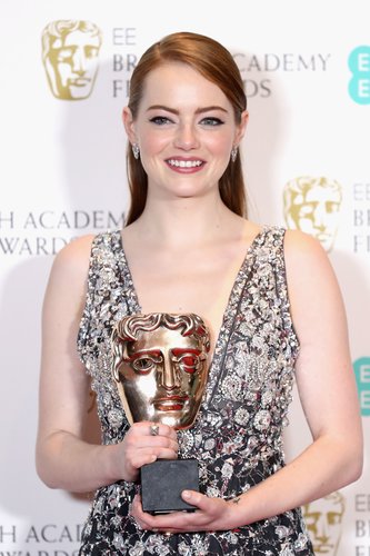 Emma Stone poses with her award in the winners room during the 70th EE British Academy Film Awards (BAFTA) at Royal Albert Hall on February 12, 2017 in London