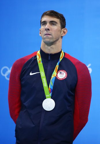 Michael Phelps of the United States celebrates winning silver in the Men's 100m Butterfly Final on Day 7 of the Rio 2016 Olympic Games at the Olympic Aquatics Stadium on August 12, 2016 in Rio de Janeiro, Brazil