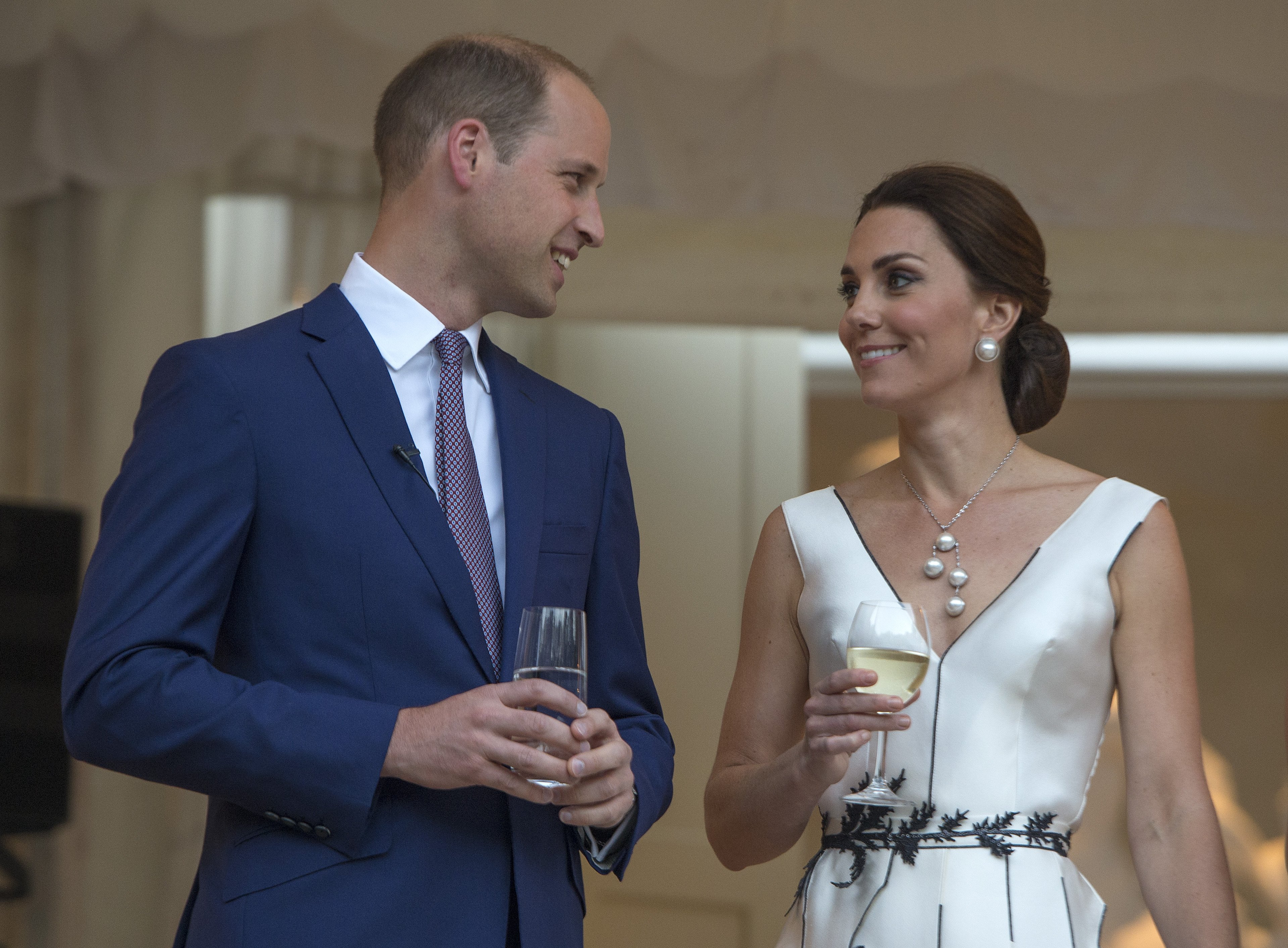 Prince William, Duke of Cambridge and Catherine, Duchess of Cambridge prepare for a toast at the Orangery on July 17, 2017 in Warsaw