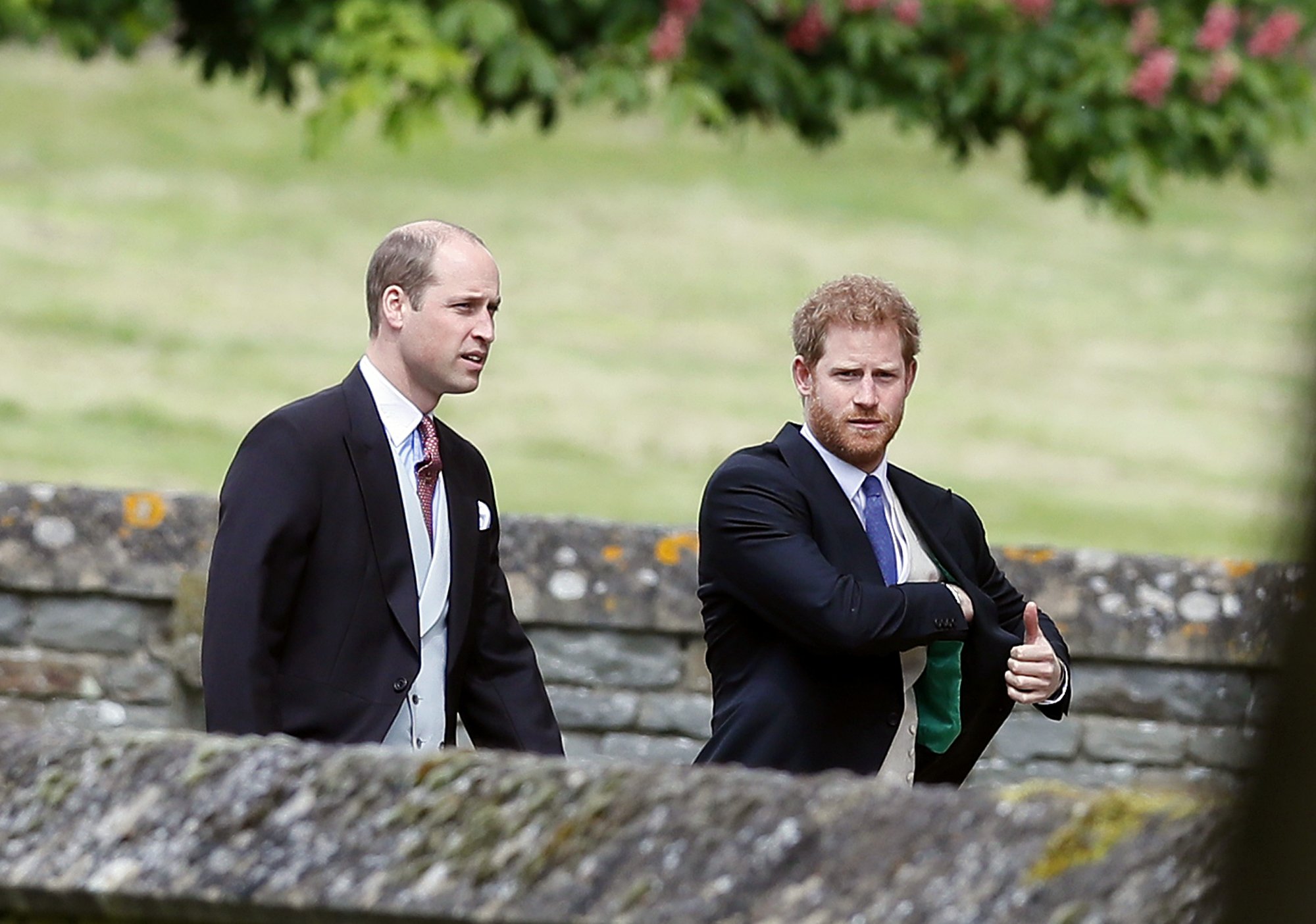 Britain's Prince William and his brother Prince Harry arrive for the wedding of Pippa Middleton and James Matthews at St Mark's Church on May 20, 2017 in Englefield Green, England