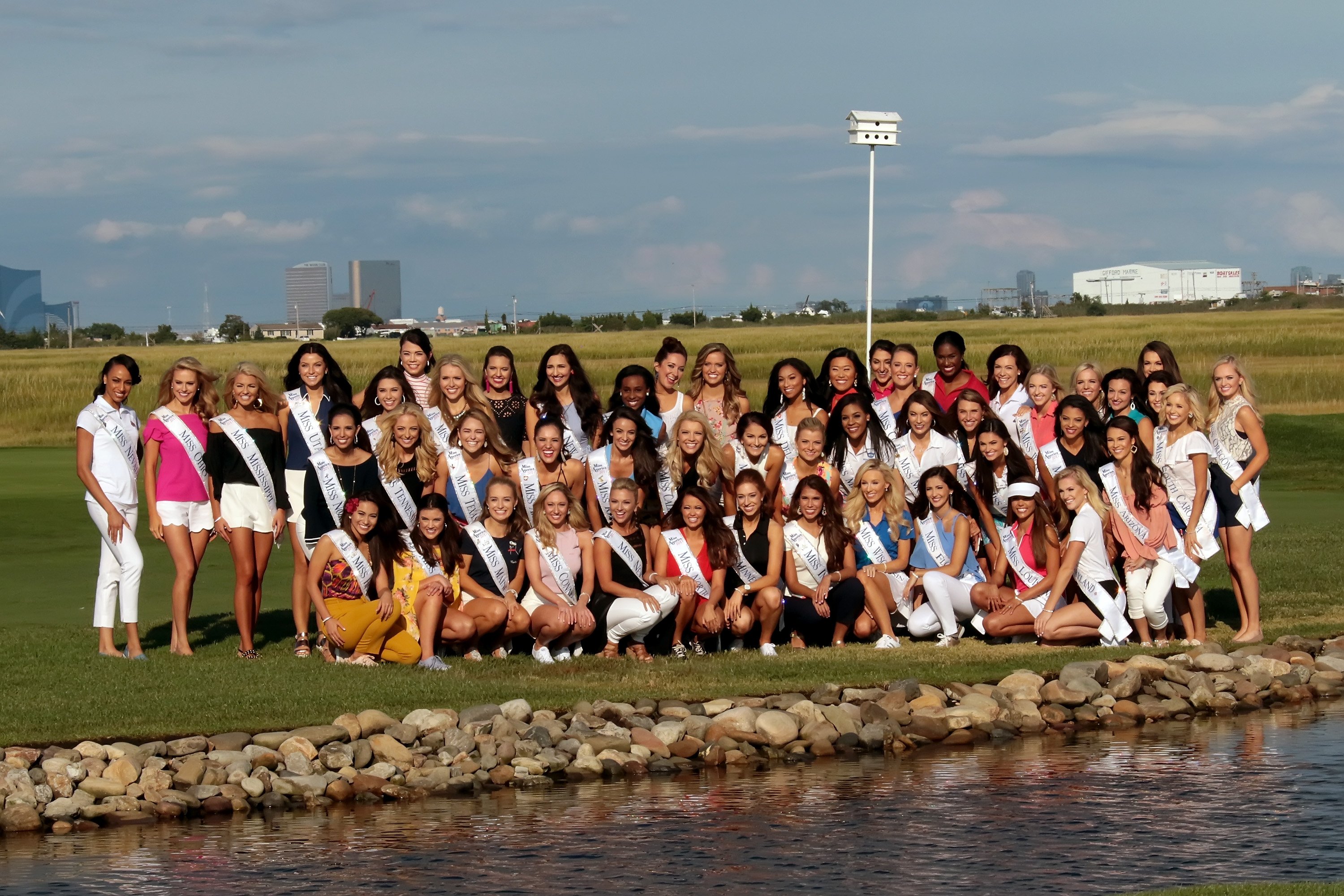 The fifty-one Miss America contestants pose on the fairway for a group photograph prior to taking golf lessons at Linwood Country Club on September 3, 2017 in Linwood, New Jersey