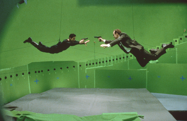 Keanu Reeves and Hugo Weaving filming a scene for The Matrix.