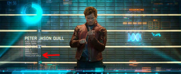 During this scene in Guardians of the Galaxy, a translator implant is listed as an enhancement under Peter Quill's profile. This would explain why he's able to communicate with every alien in the universe.