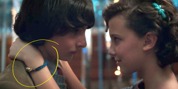 Now let's jump forward to Season 2 — Check out what Eleven is wearing on HER wrist here at the Snow Ball.