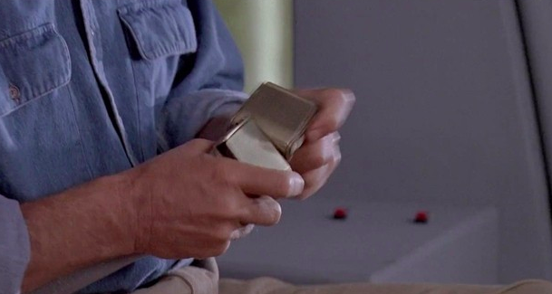 Alan's belt buckle has two female ends at the beginning of Jurassic Park.