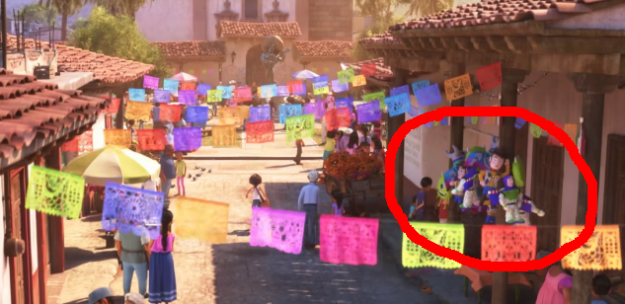 In Coco, there are Buzz and Woody toys hanging in the town streets.