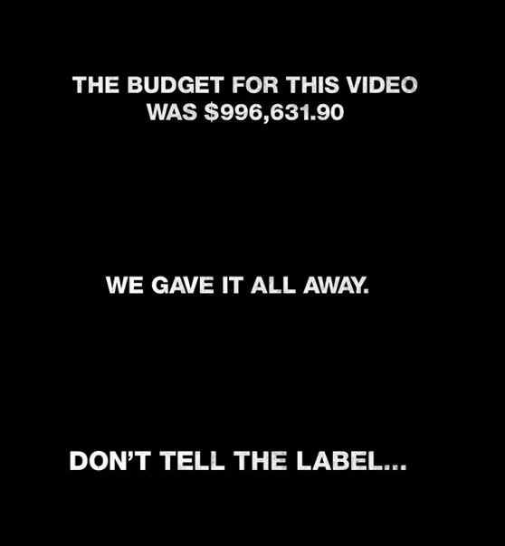 "The budget for this video was $996,631.90," the music video states. "We gave it all away. But don't tell the label..."