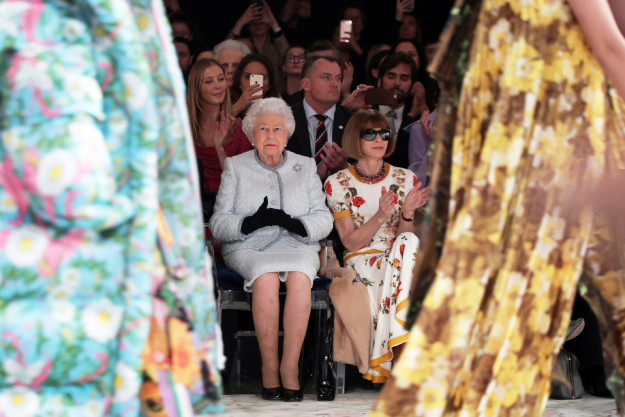 But also literal royalty! Here's Queen Elizabeth II sitting in the front row on Tuesday next to Vogue editor-in-chief Anna Wintour.
