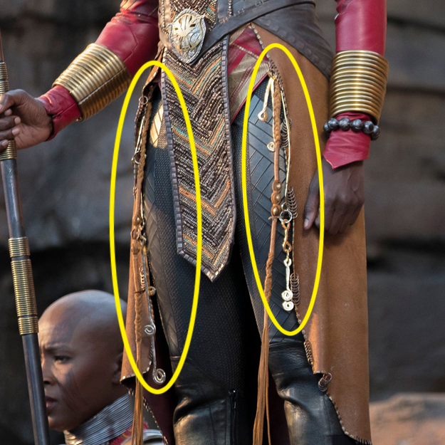 The gold rings on Okoye’s uniform are meant to be trinkets inspired by good luck charms from Filipino culture.