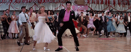 Danny goes to the dance with Sandy, and it almost seems like he's going to start acting like a normal person — they do these really cute dance moves: